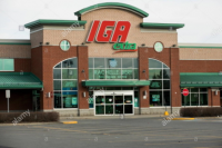 a-logo-sign-outside-of-a-iga-retail-grocery-store-location-in-greenfield-park-quebec-canada-on-april-23-2019-TB3MPN.jpg